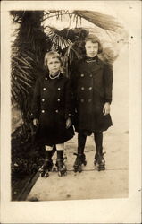 Two Children on Rollerskates Postcard