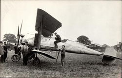 People Standing Next to An Airplane Postcard