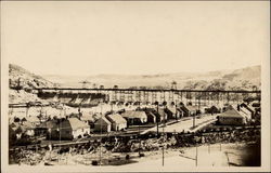 Town along dam construction Postcard