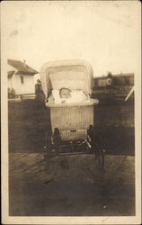 Baby in carriage Postcard