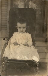 A Baby Sitting in a Chair Babies Postcard Postcard