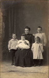 Portrait of a mother and her four children Postcard