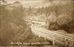 Bridge through the forest Garberville, CA Postcard Postcard