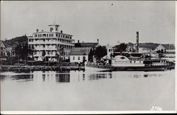 Riverboat Docked with Building in the Background Postcard