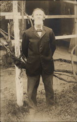 Gentleman standing outside home Postcard