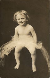 Portrait of a 2-year-old child with curly hair Postcard