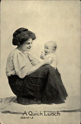 Woman feeding baby Postcard