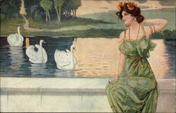 Woman seated by pond with swans Postcard