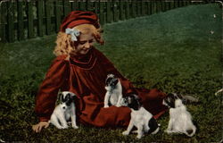 Girl Playing With Four Puppies Postcard