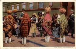 Pueblo Indians selling pottery Postcard