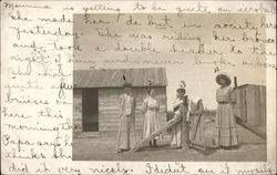 Four women outside home Lamar, CO Postcard Postcard