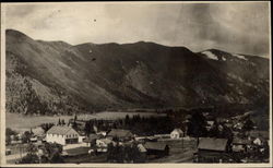 Scene of town at base of mountains Colorado Postcard Postcard