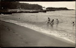 Playing in the water at the beach Hawaii Postcard Postcard