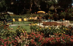 Flower filled patio of Hotel Laguna Laguna Beach, CA Postcard Postcard