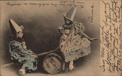 Girl and Boy in Clown Costumes on a See Saw Postcard