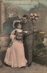 Couple Reading Outside Couples Postcard Postcard