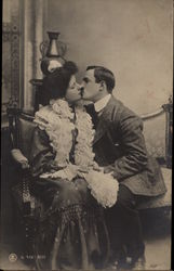 Man Kissing Girl on Couch Postcard