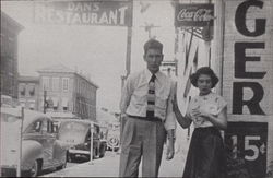 Couple in Front of Dan's Restaurnat Postcard