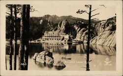 View of Sylvan Lake with Rocks, Trees and Building Postcard