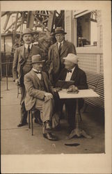 Four Friends at Sidewalk Table Men Postcard Postcard