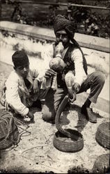 Snake Charmer with a Young Boy Postcard