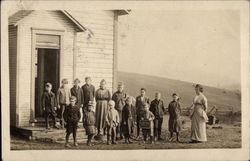 Children and Teacher Posing outside School House School and Class Photos Postcard Postcard