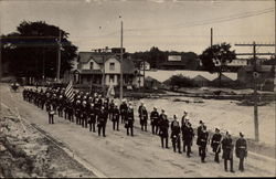 US Soldiers Marching Down Street Postcard