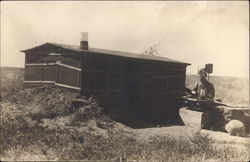 Man Outside Sod Home in Plains Postcard