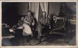 Family Relaxing in Parlor Postcard