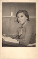 GIrl Sitting at Desk with a Book Girls Postcard Postcard