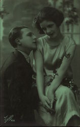 Young Woman Seated on Man's Knee Postcard