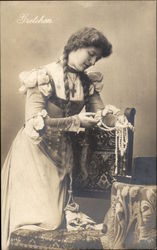 Gretchen - Young Woman looking at String of Beads Postcard