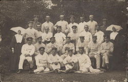 Group of Men in White Uniforms with Two Nuns Postcard