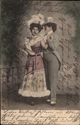 Man in tails holding woman in red and white dress Postcard