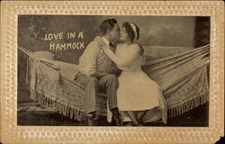 black and white photo of a couple sitting on a hammock and kissing Postcard Postcard