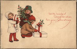 Three Children Carrying Holly Sprigs and Christmas Presents Postcard