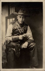 Sitting Cowboy Holding a Gun Postcard