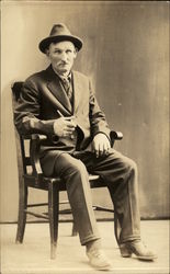 Philip Murphey Posing in Chair Postcard