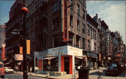 Looking up Pell St. in the heart of New York City's Chinatown Postcard