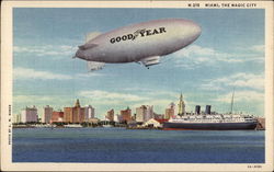 Good Year Blimp over the City Postcard