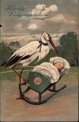 Stork Rocking a Baby in a Cradle Storks Postcard Postcard