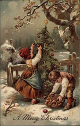 Children Collecting Apples and Decorating a Christmas Tree Outside Postcard Postcard