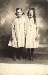 Two Girls in Matching Dresses Postcard