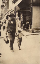 Father & Son Walking Through Town Postcard