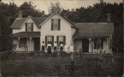 Family In Front of Home Postcard