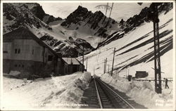 Train Into Snow Covered Mountains Postcard