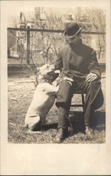 Man in Hat with Pit Bull Dogs Postcard Postcard