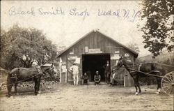 Blacksmith Shop With Men and Horses Postcard