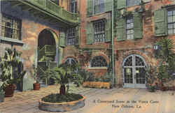 A Courtyard Scene In The Vieux Carre New Orleans, LA Postcard Postcard