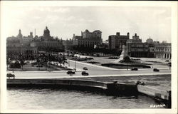 Waterside scene with monument Postcard